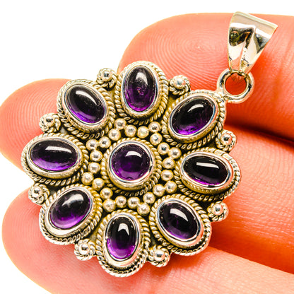 Amethyst pendant in sterling silver with round purple cabochon cluster