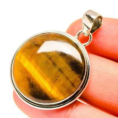 Tiger eye pendant, sterling silver bezel and bail with round amber stone