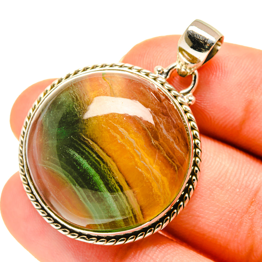 Fluorite pendant in 925 sterling silver, round cabochon with green stripe and orange-gold