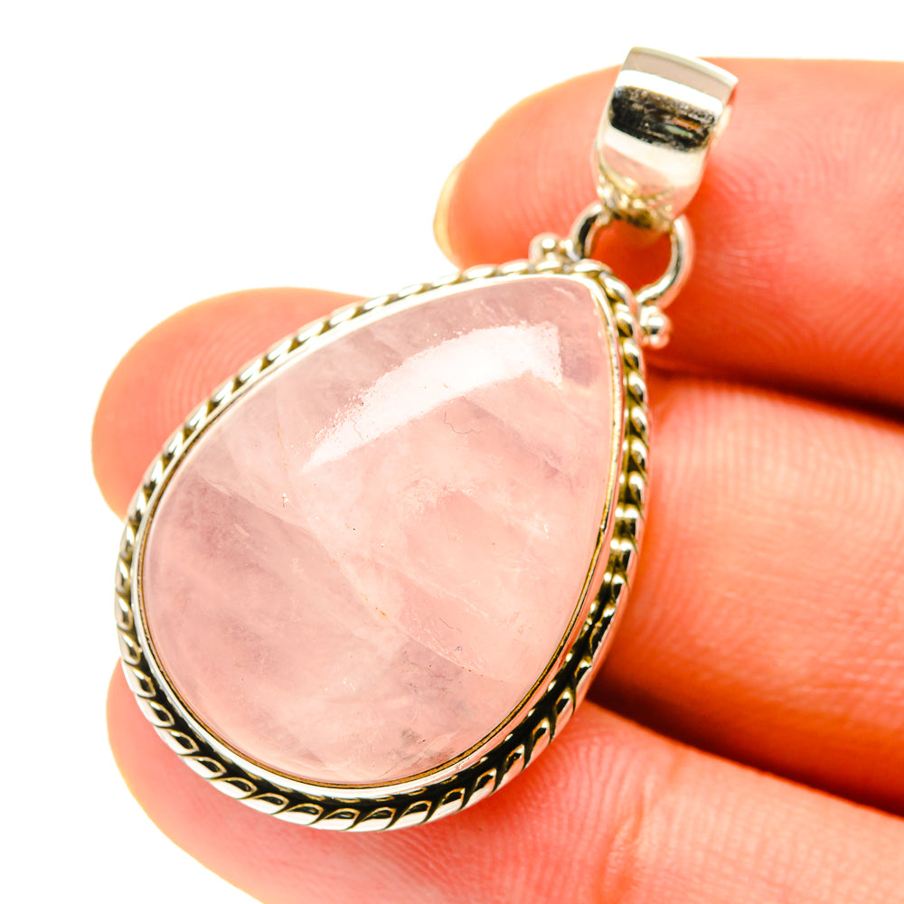 Rose quartz teardrop pendant, 925 sterling silver bezel with textured border