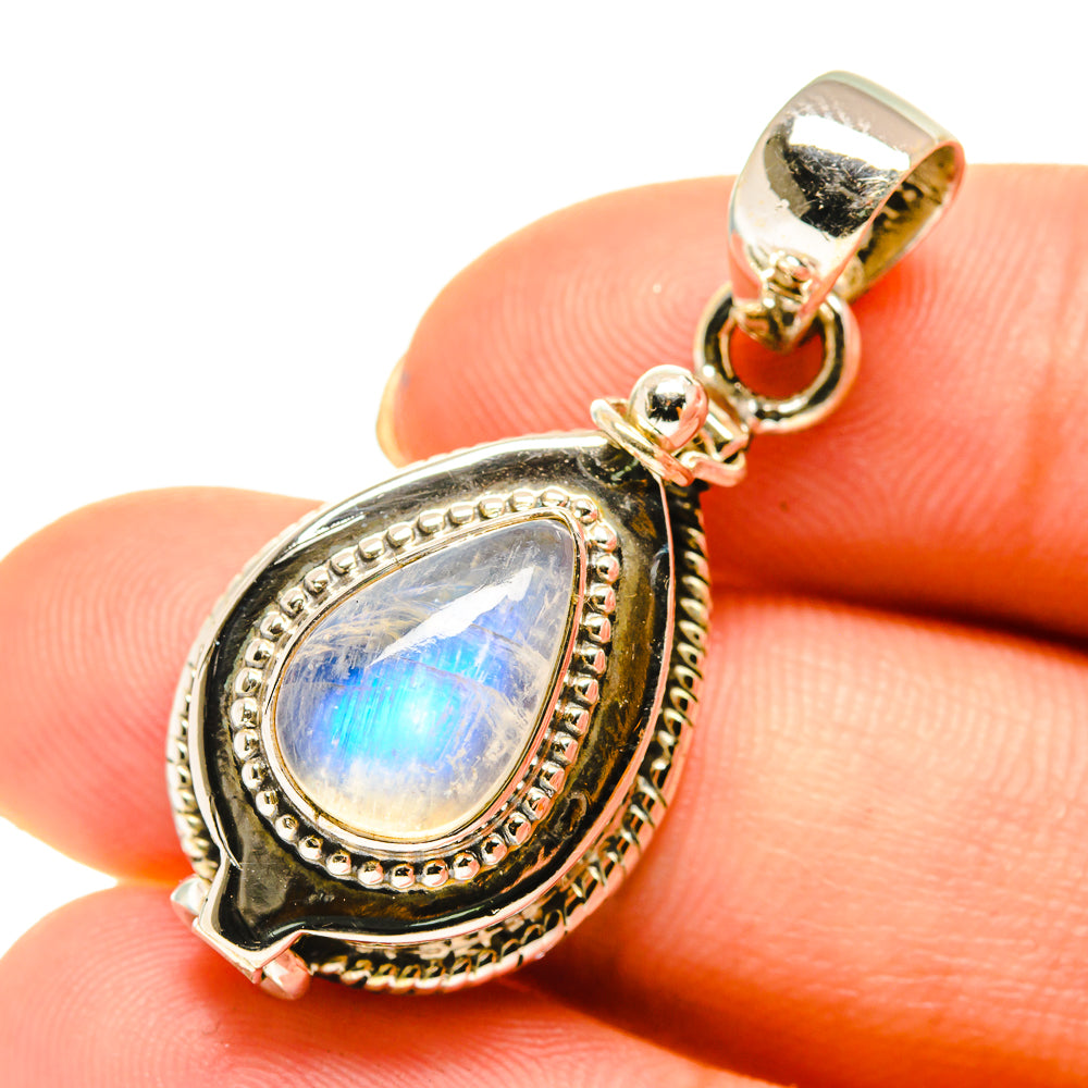 Teardrop rainbow moonstone pendant with ornate sterling silver bezel and loop bail