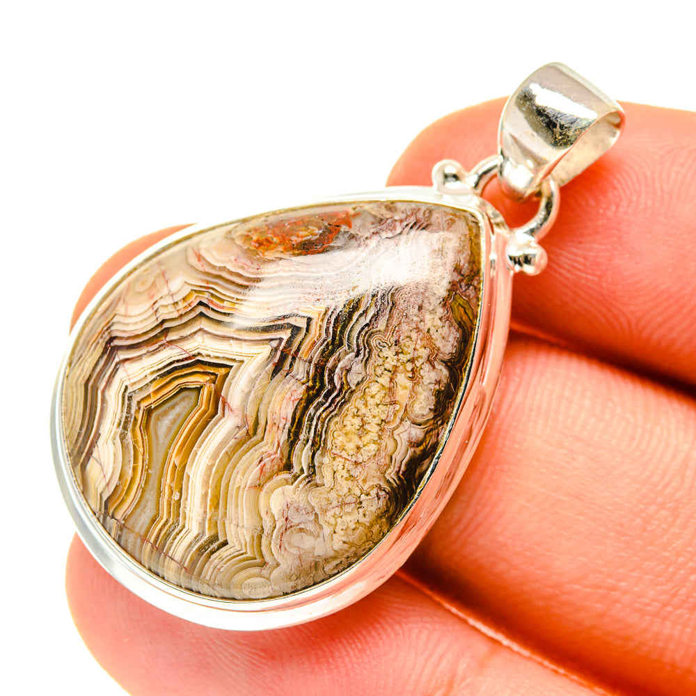 Lace agate pendant in teardrop setting with 925 sterling silver and silver bail.