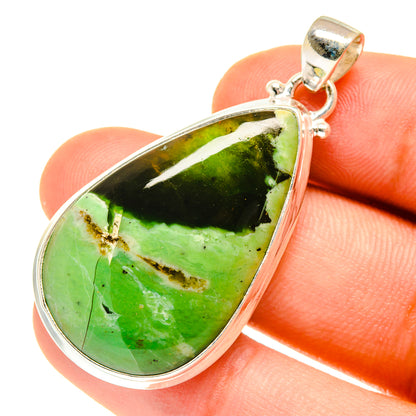 Green opal teardrop pendant close-up with sterling silver frame and bail