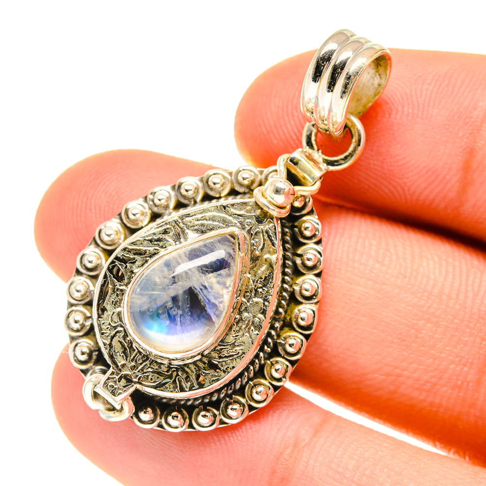 Ornate teardrop moonstone pendant in 925 sterling silver with blue iridescent cabochon