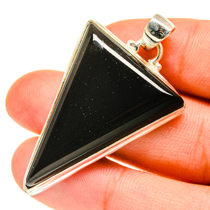Triangular black onyx pendant in sterling silver setting, bail and frame