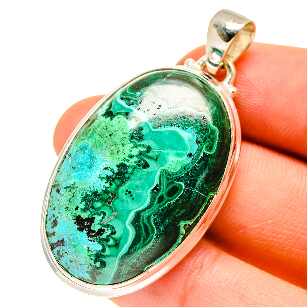 Malachite and chrysocolla oval pendant with gold-tone bail and silver rim