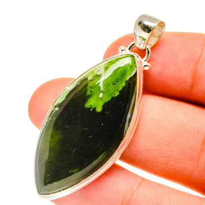 Green opal pendant in 925 sterling silver bezel with small bail, teardrop shape