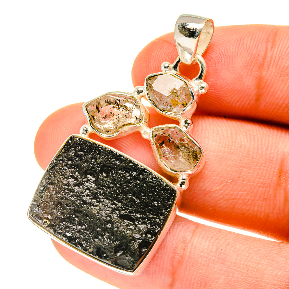Silver pendant with dark druzy stone, three small crystal bezel stones and bail