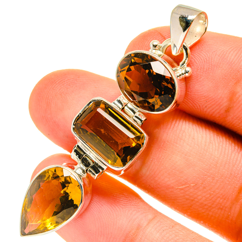 Sterling silver citrine pendant close-up with three geometric stone bezels