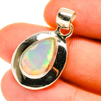Teardrop opal pendant in gold-tone setting with faceted Ethiopian opal
