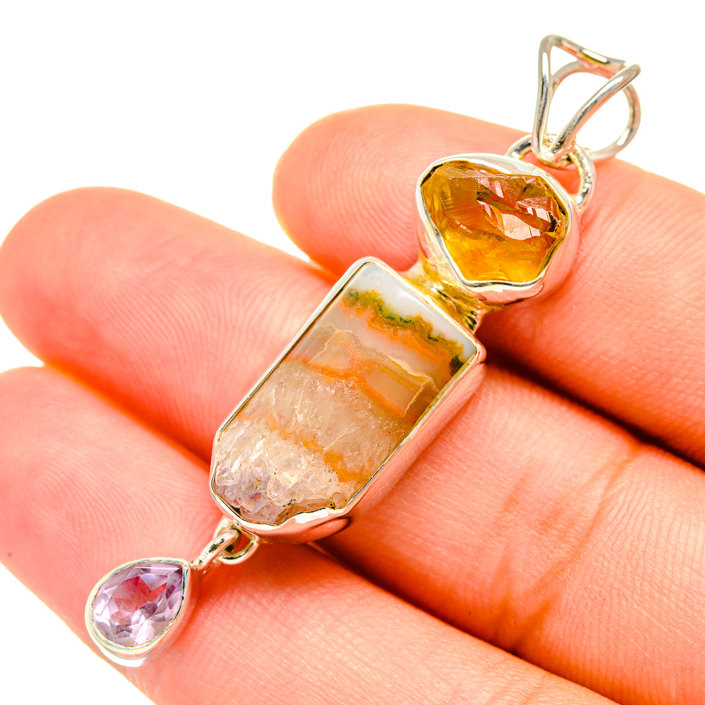 Sterling silver gemstone pendant close-up with faceted yellow citrine, pink amethyst, rectangular bar