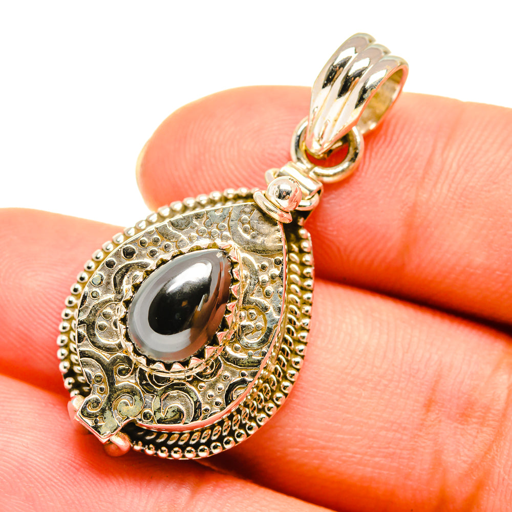Hematite poison pendant in 925 sterling silver with dark teardrop center, ornate frame