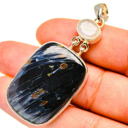 Oval pietersite pendant with dark blue stone and gold flecks, round moonstone bail