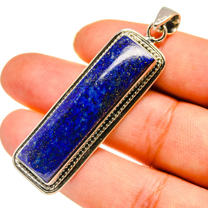 Lapis lazuli pendant close-up, blue rectangular stone in 925 sterling silver frame