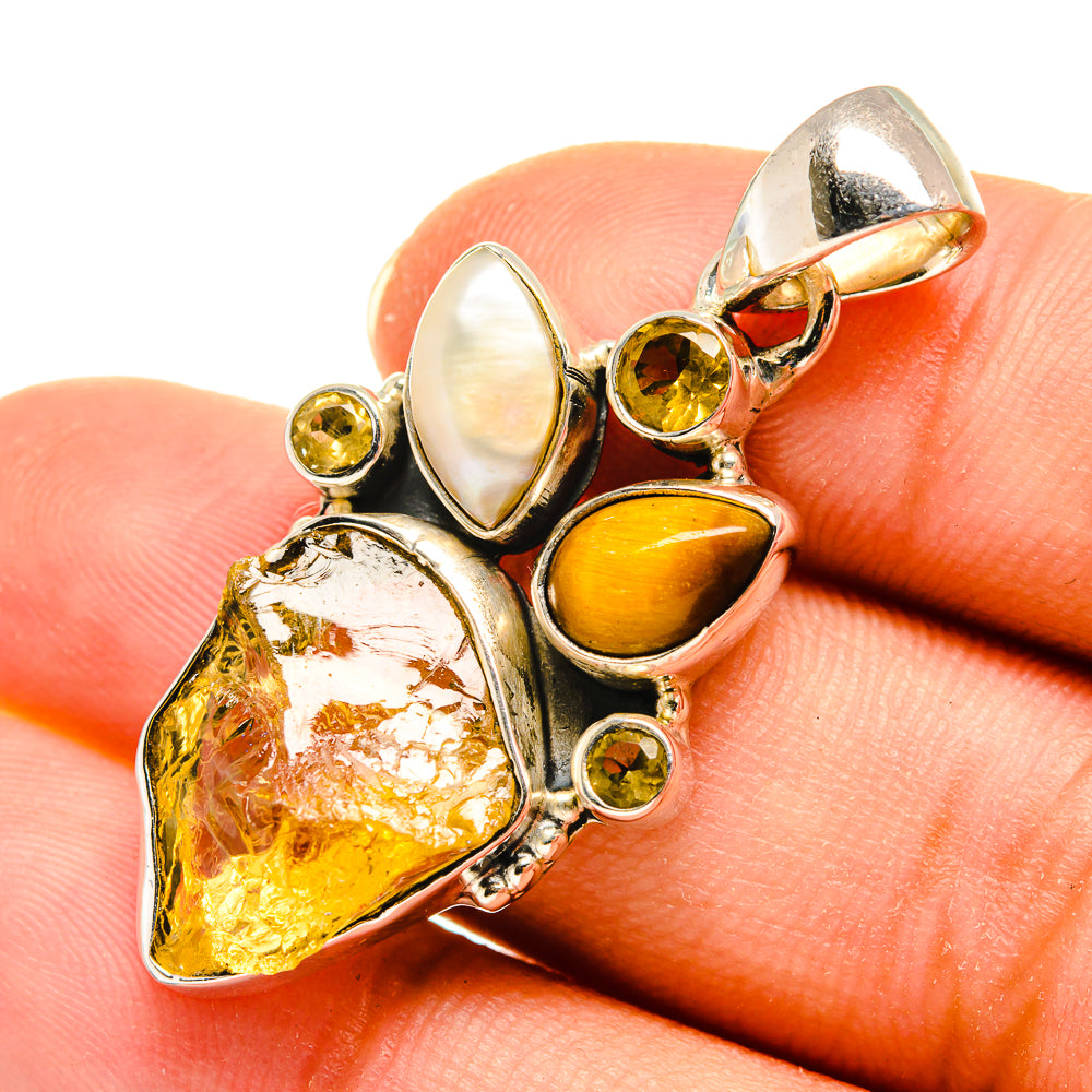 Sterling silver gemstone pendant with rough golden stone, mother-of-pearl, and yellow accents