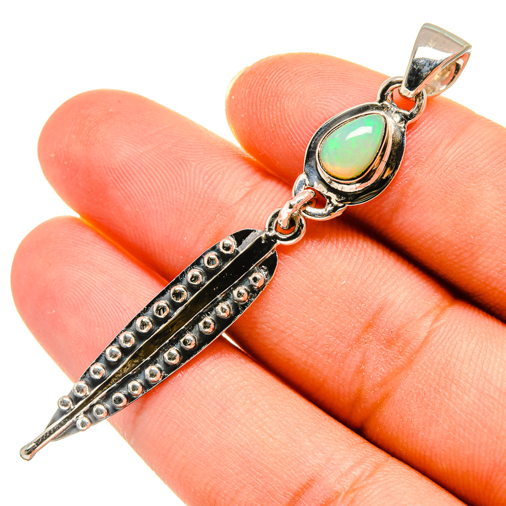 925 sterling silver opal pendant with oval iridescent green stone and riveted bar detail