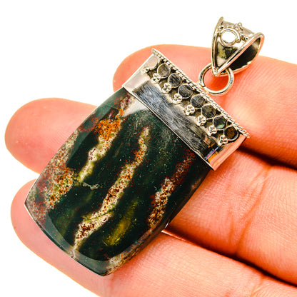 Bloodstone pendant in rectangular sterling silver setting with loop bail, green gemstone cabochon