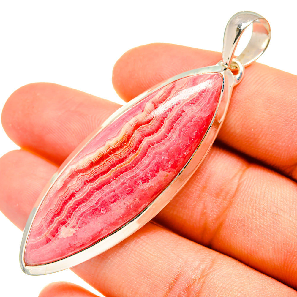 Rhodochrosite pendant with teardrop cabochon in 925 silver, top bail visible