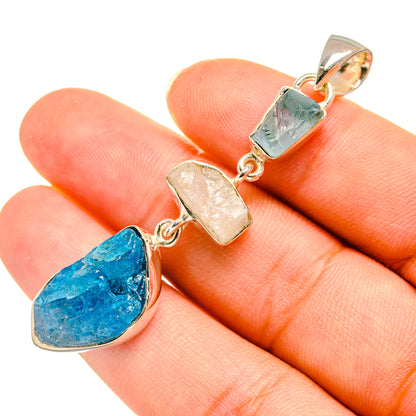 Teardrop blue gemstone pendant with green and clear bead, silver-tone bail and links
