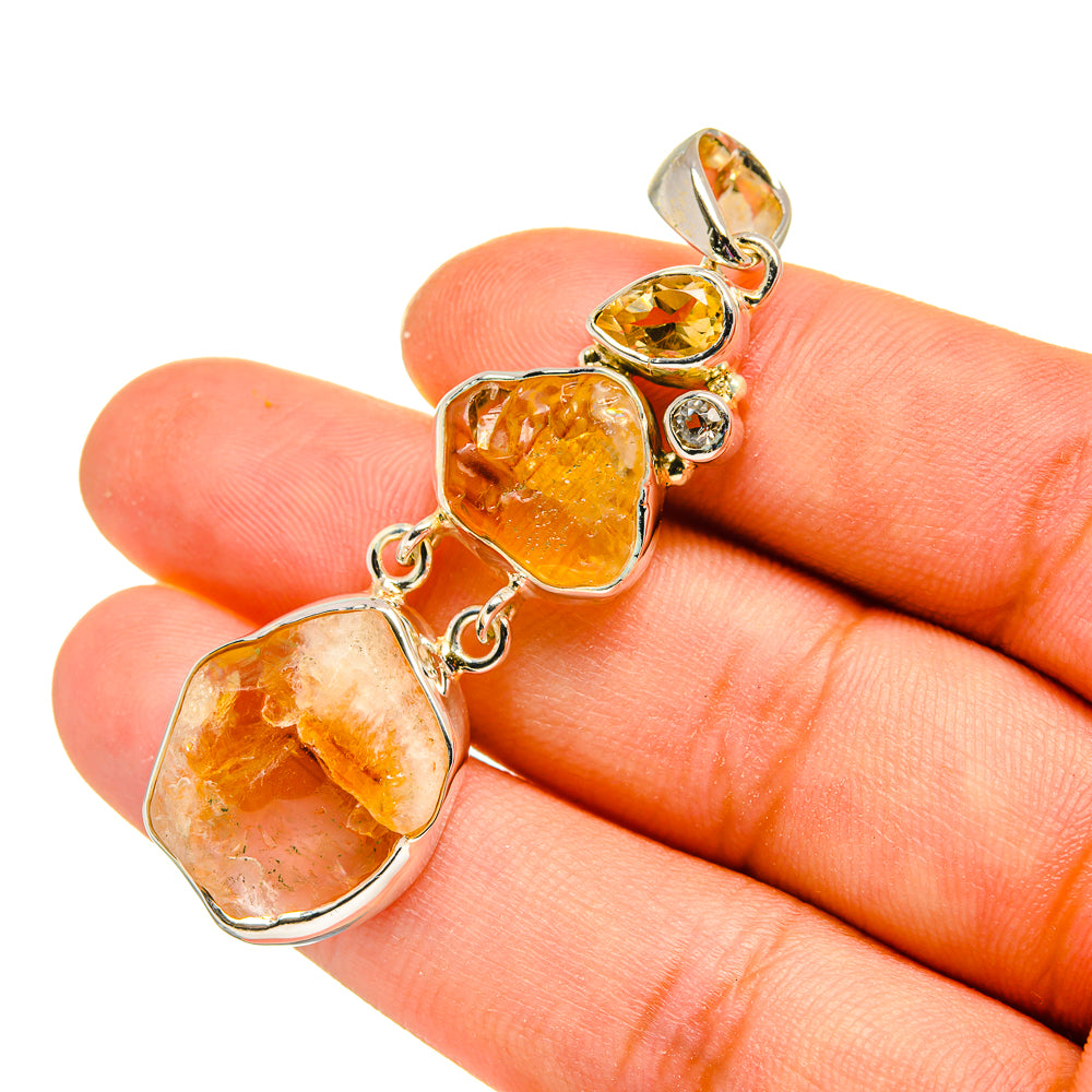 Sterling silver citrine pendant with three rough yellow-orange stones and small round accents