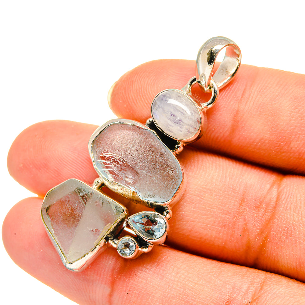 Rough aquamarine pendant with oval blue topaz and small round stones, 925 silver