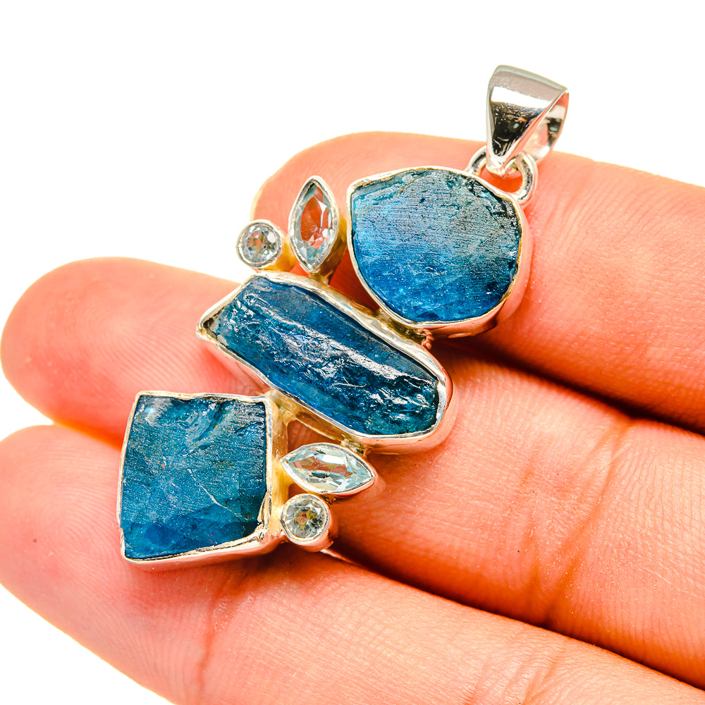 Rough blue topaz pendant in sterling silver with faceted clear accents, bail at top