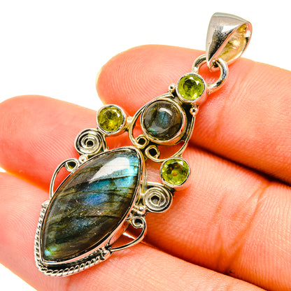 Labradorite and peridot pendant close-up in 925 sterling silver, oval and round gems