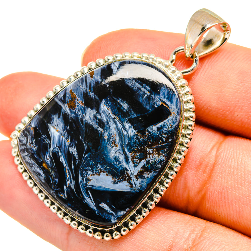 Sterling silver pietersite pendant with blue veined stone in raised teardrop frame
