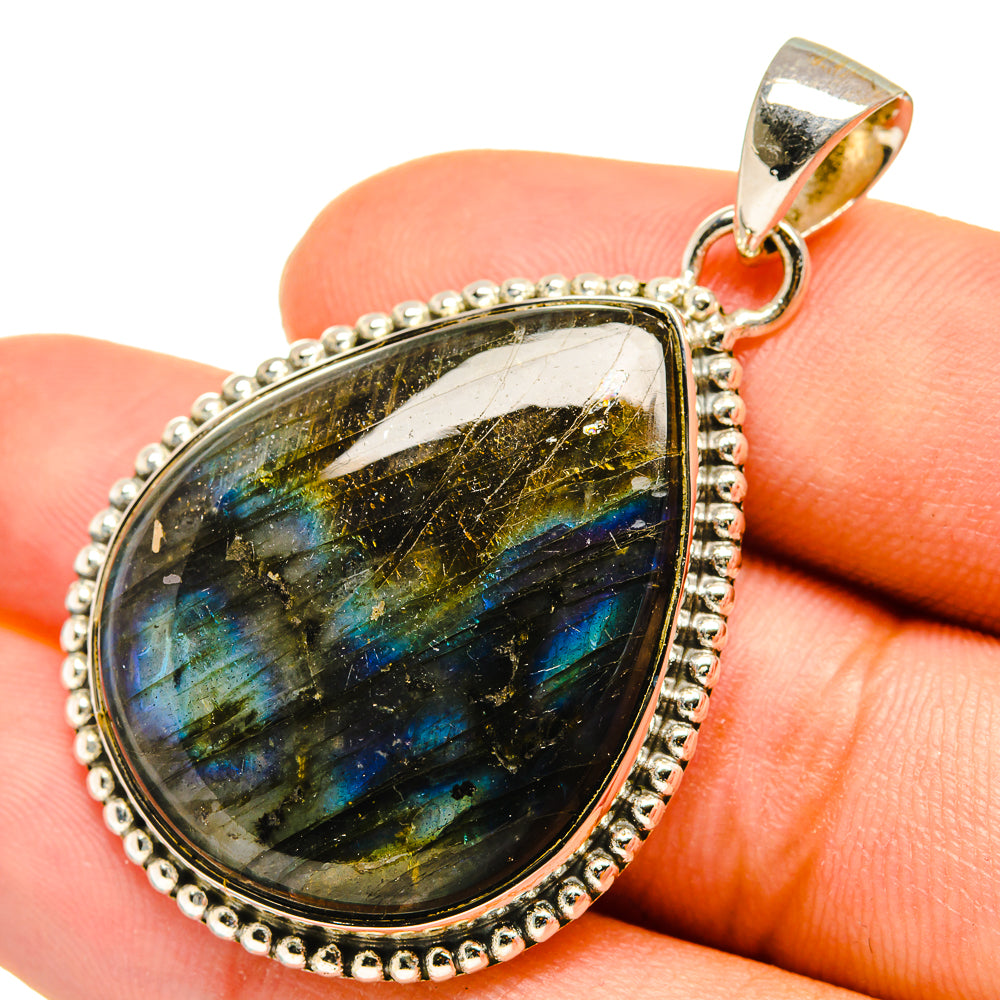 Labradorite pendant in pear shape, blue-gold shimmer, with sterling silver bezel and bail