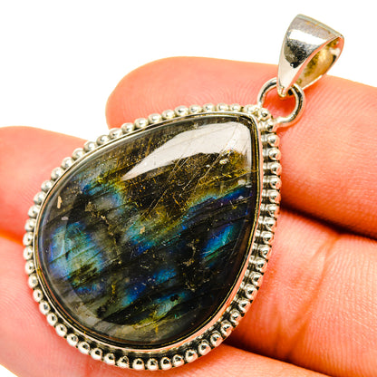 Labradorite pendant in pear shape, blue-gold shimmer, with sterling silver bezel and bail