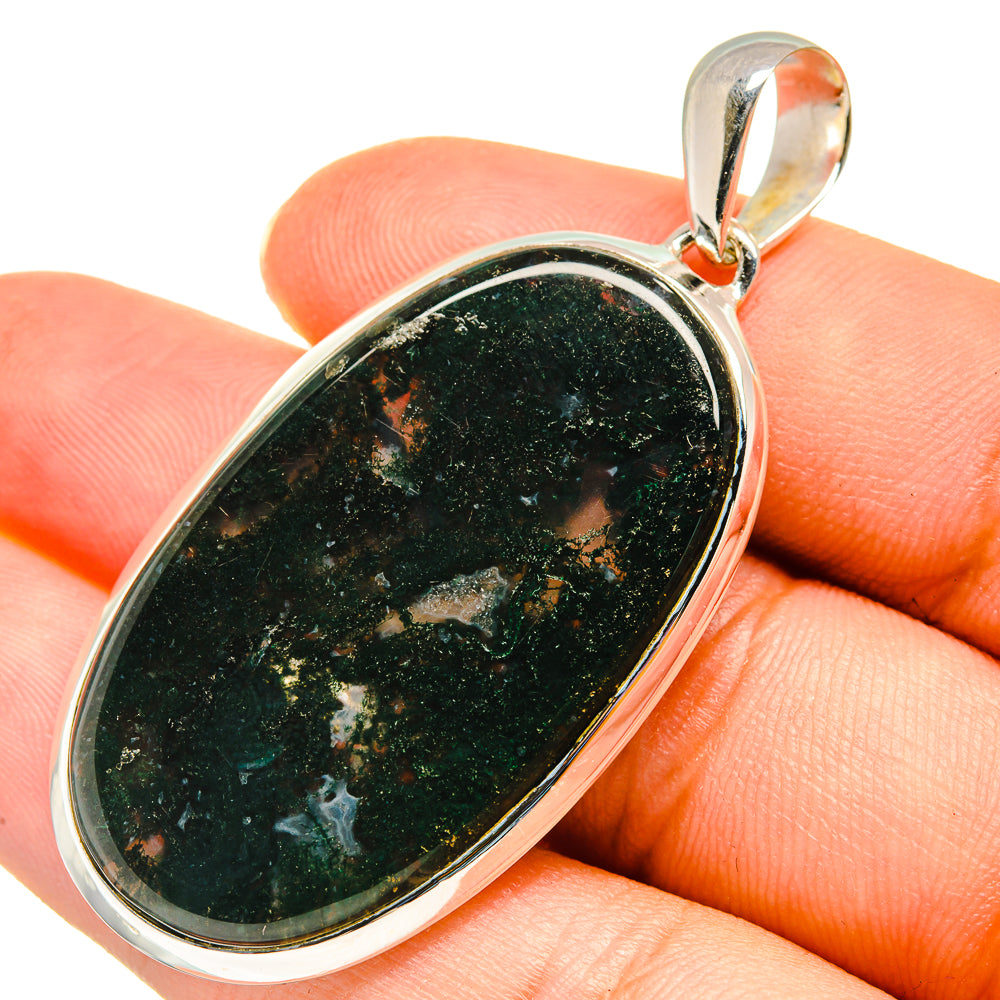 Oval dark agate pendant with mossy speckled pattern in polished 925 sterling silver bezel