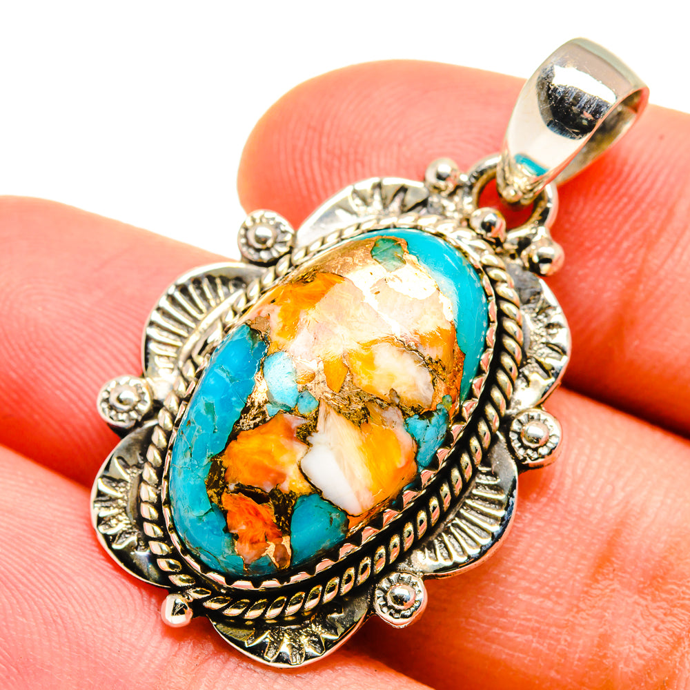 Turquoise gemstone pendant with oval stone in ornate silver-tone bezel
