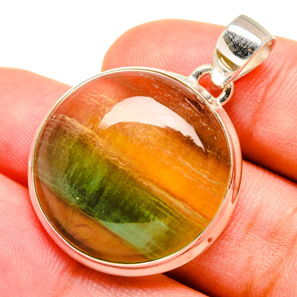Green fluorite pendant in sterling silver bezel, oval cabochon with orange-green band