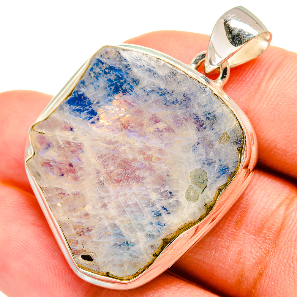 Rough moonstone pendant with blue and pale rainbow bands, sterling silver bail and bezel
