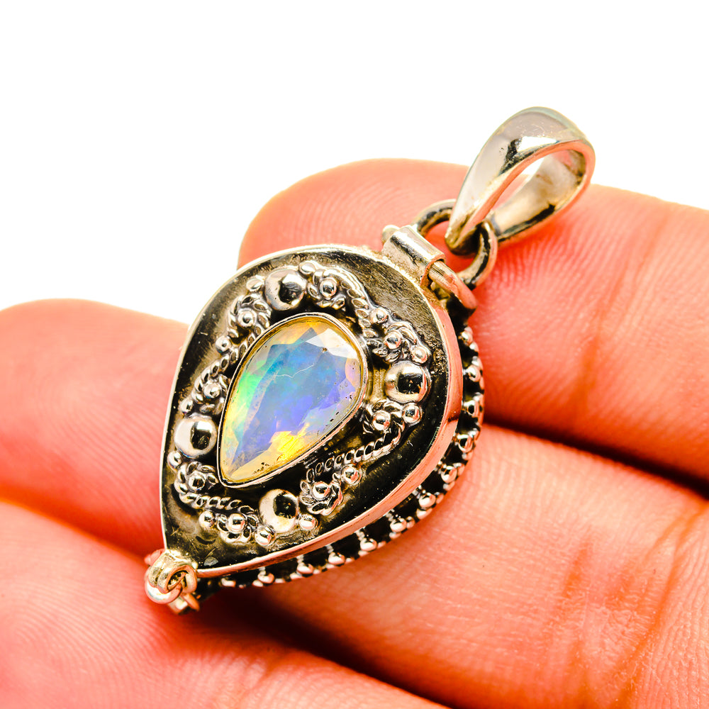 Ethiopian opal pendant in silver with faceted oval center and ornate halo setting
