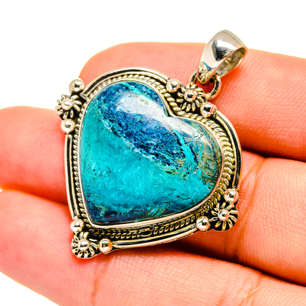 Heart-shaped turquoise stone pendant in gold-tone 925 silver with ornate frame