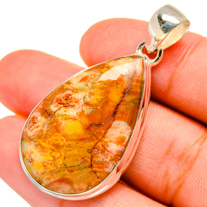 Orange teardrop jasper pendant with sterling silver bezel and loop bail