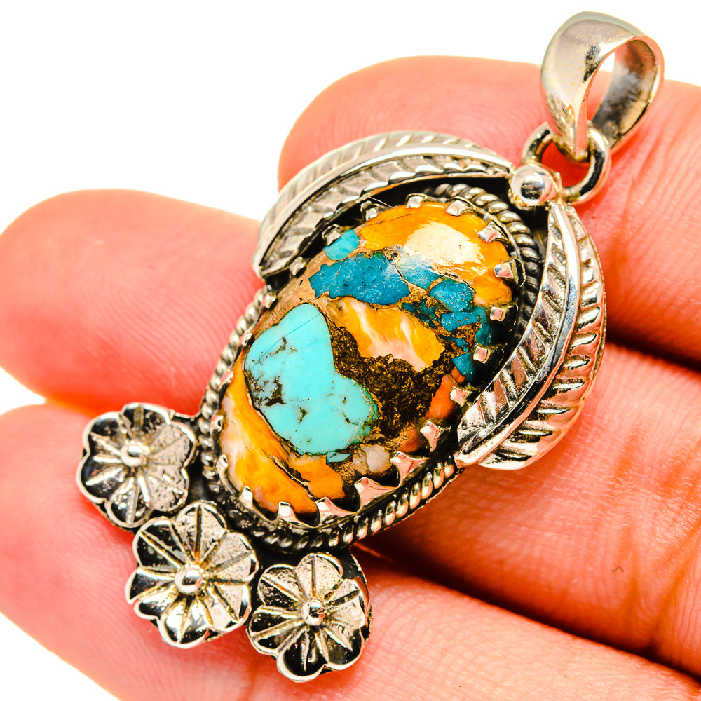 Turquoise and orange oval stone pendant with sterling silver rope border and flower dangles