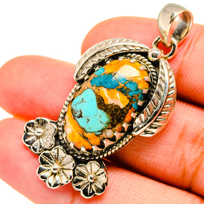 Turquoise and orange oval stone pendant with sterling silver rope border and flower dangles