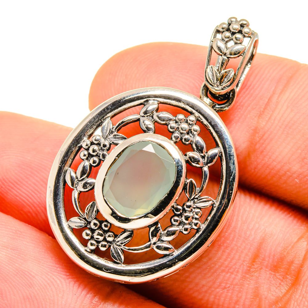Sterling silver pendant with aqua oval stone and filigree border, bail with small beads