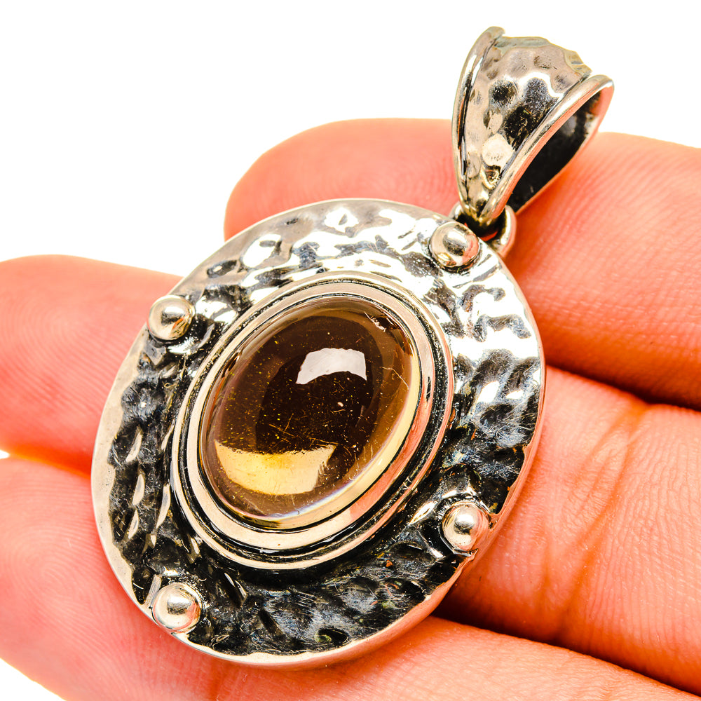 Oval citrine pendant with amber cabochon and textured 925 sterling silver halo bezel