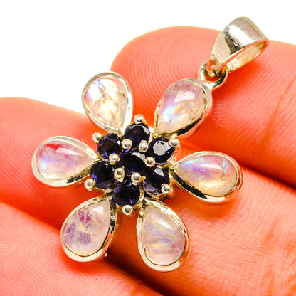 Opal-like moonstone flower pendant in sterling silver with oval stones, dark purple center and bail