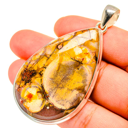Teardrop jasper pendant in amber, yellow, and dark marbling with silver bail