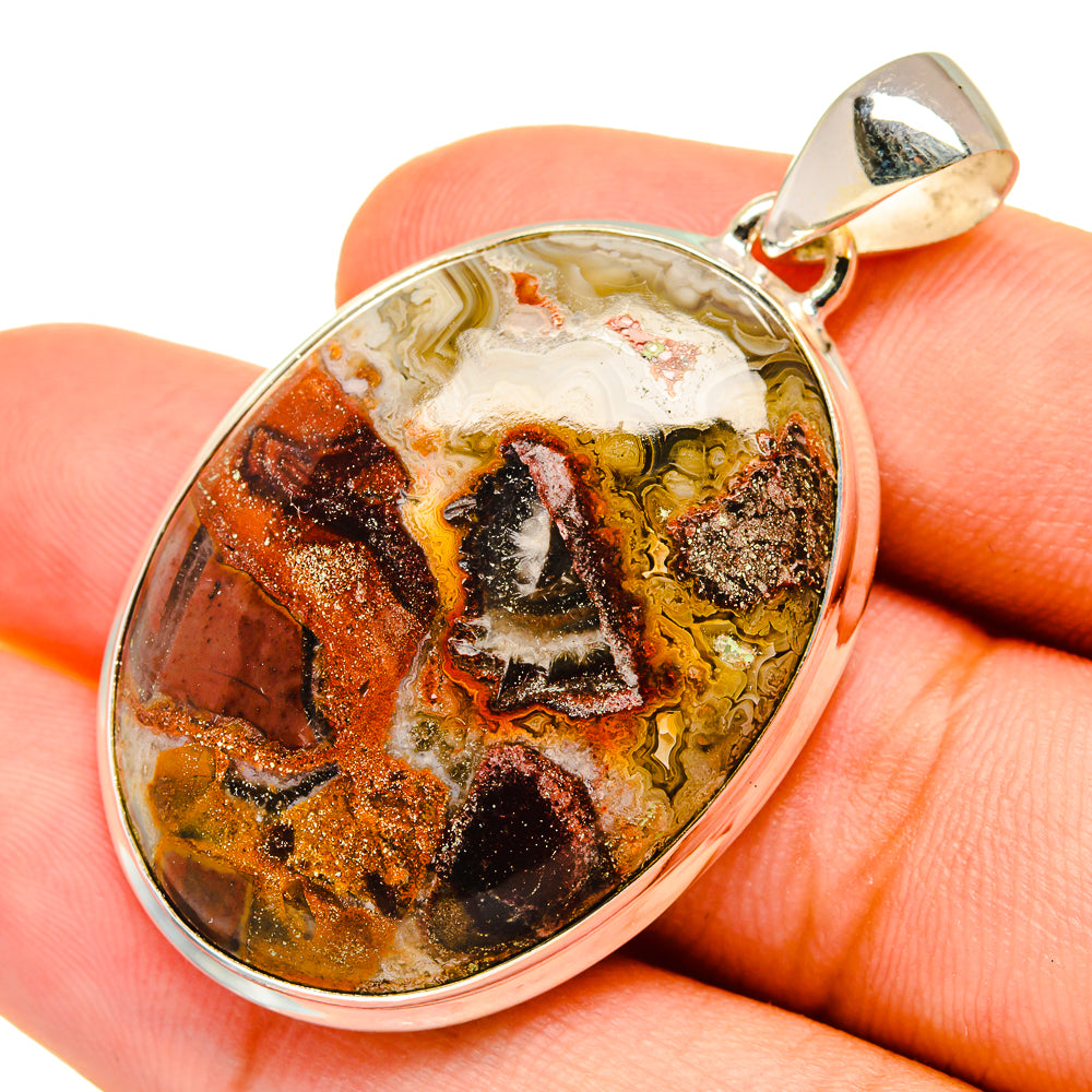 Crazy lace agate pendant in polished 925 sterling silver with oval multicolor stone.