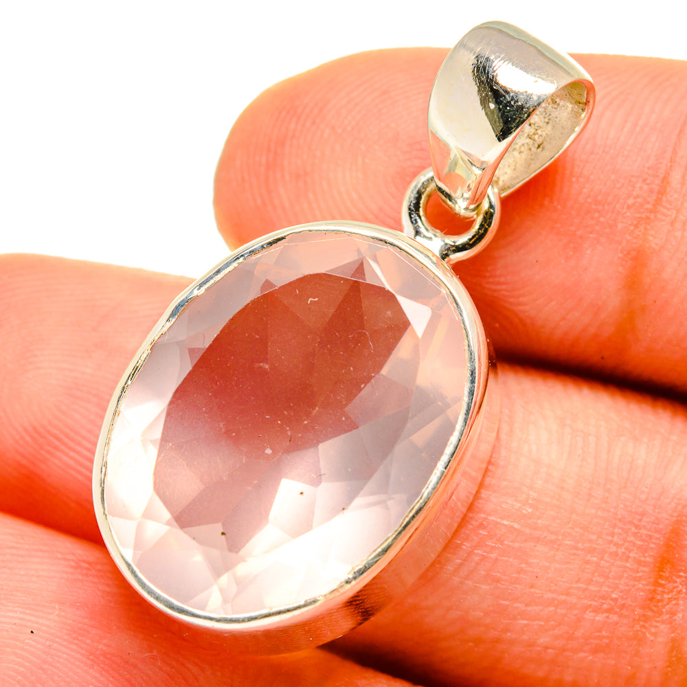 Oval rose quartz pendant close-up in 925 sterling silver with reflective bezel and bail