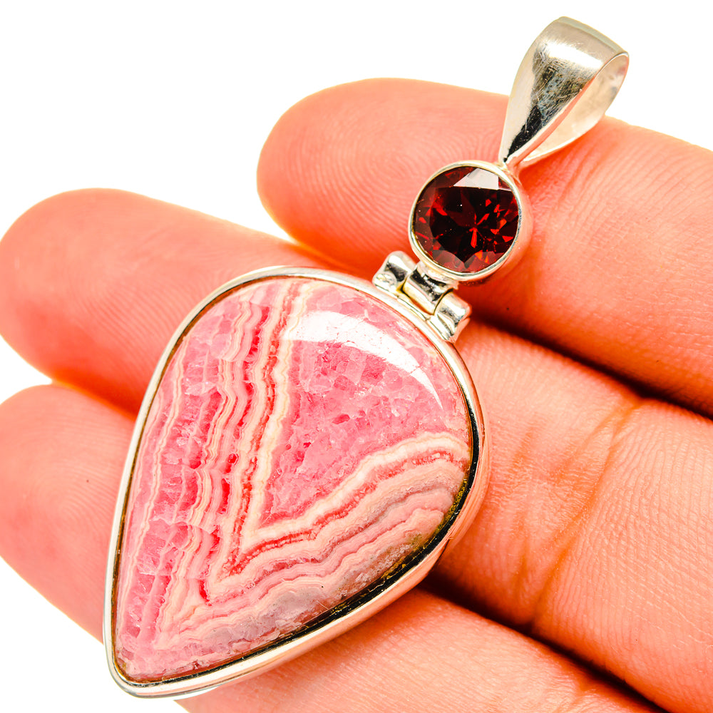 Rhodochrosite gemstone pendant with red garnet in silver bezel on teardrop frame