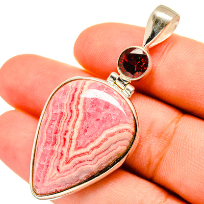 Rhodochrosite gemstone pendant with red garnet in silver bezel on teardrop frame