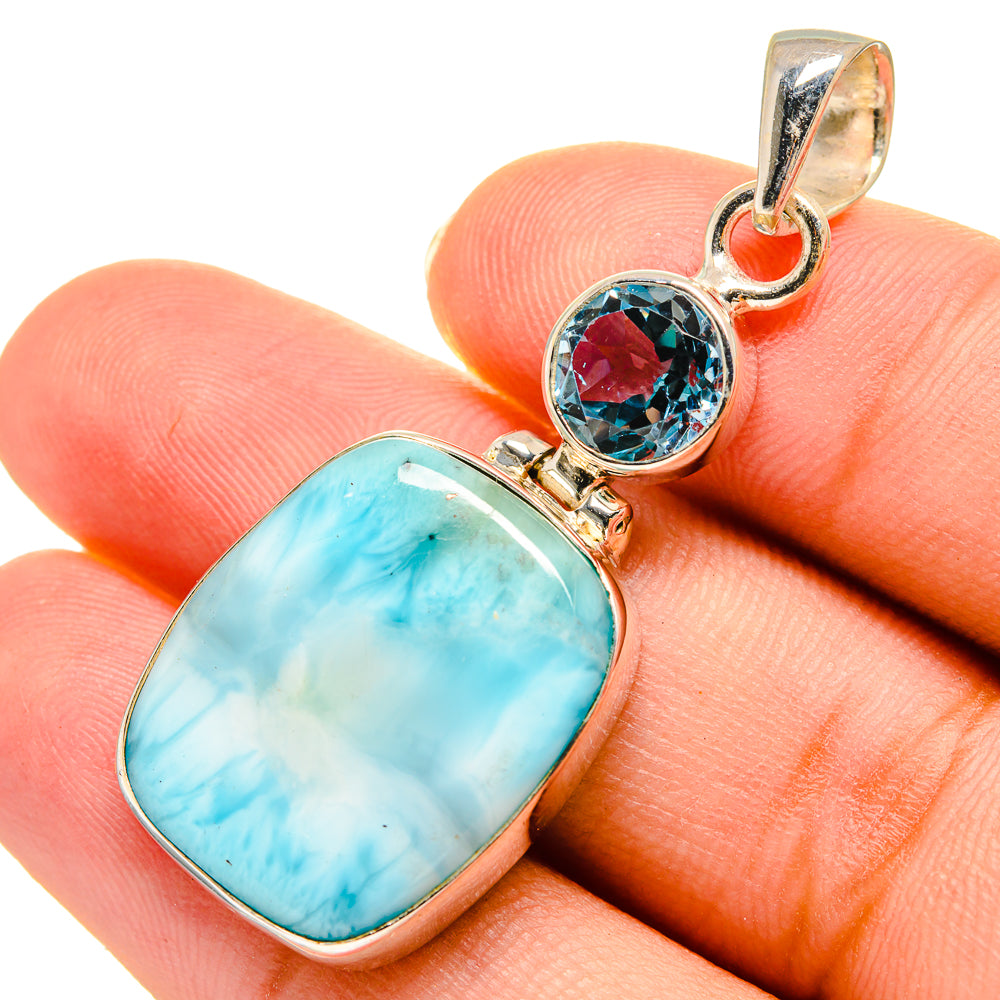 Sterling silver pendant with oval blue larimar and round blue topaz stone