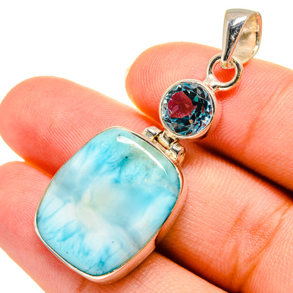 Sterling silver pendant with oval blue larimar and round blue topaz stone