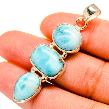 Larimar pendant close-up: three oval larimar cabochons with silver top loop bail